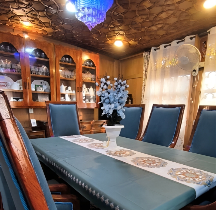 Traditional Kashmiri carved wood interiors at Nageen Castle houseboat Srinagar